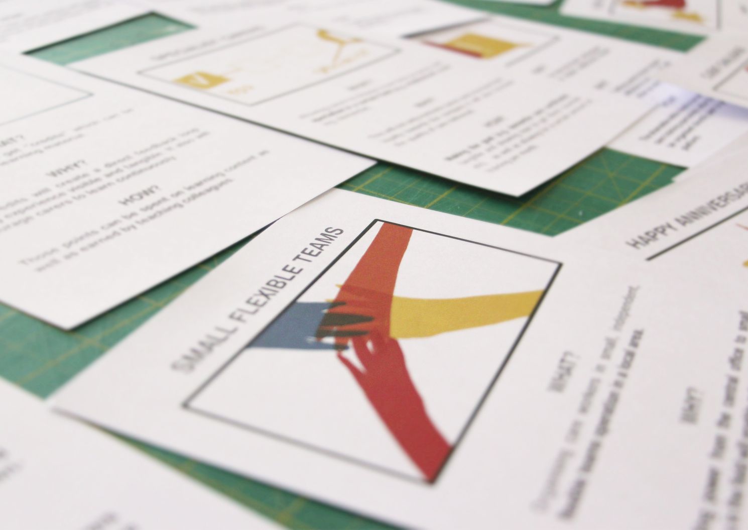 Illustrated opportunity cards spread on a cutting mat, each with a what, why and how