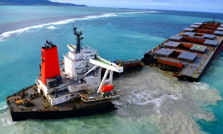 A bulk carrier broken in two on a reef, seen from above